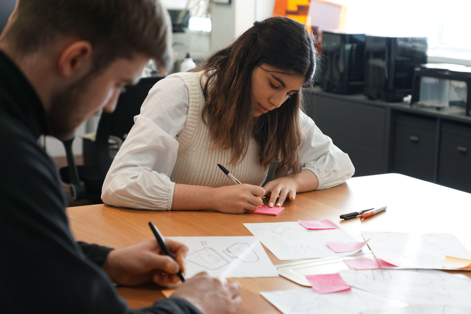 product designers sketching design concepts