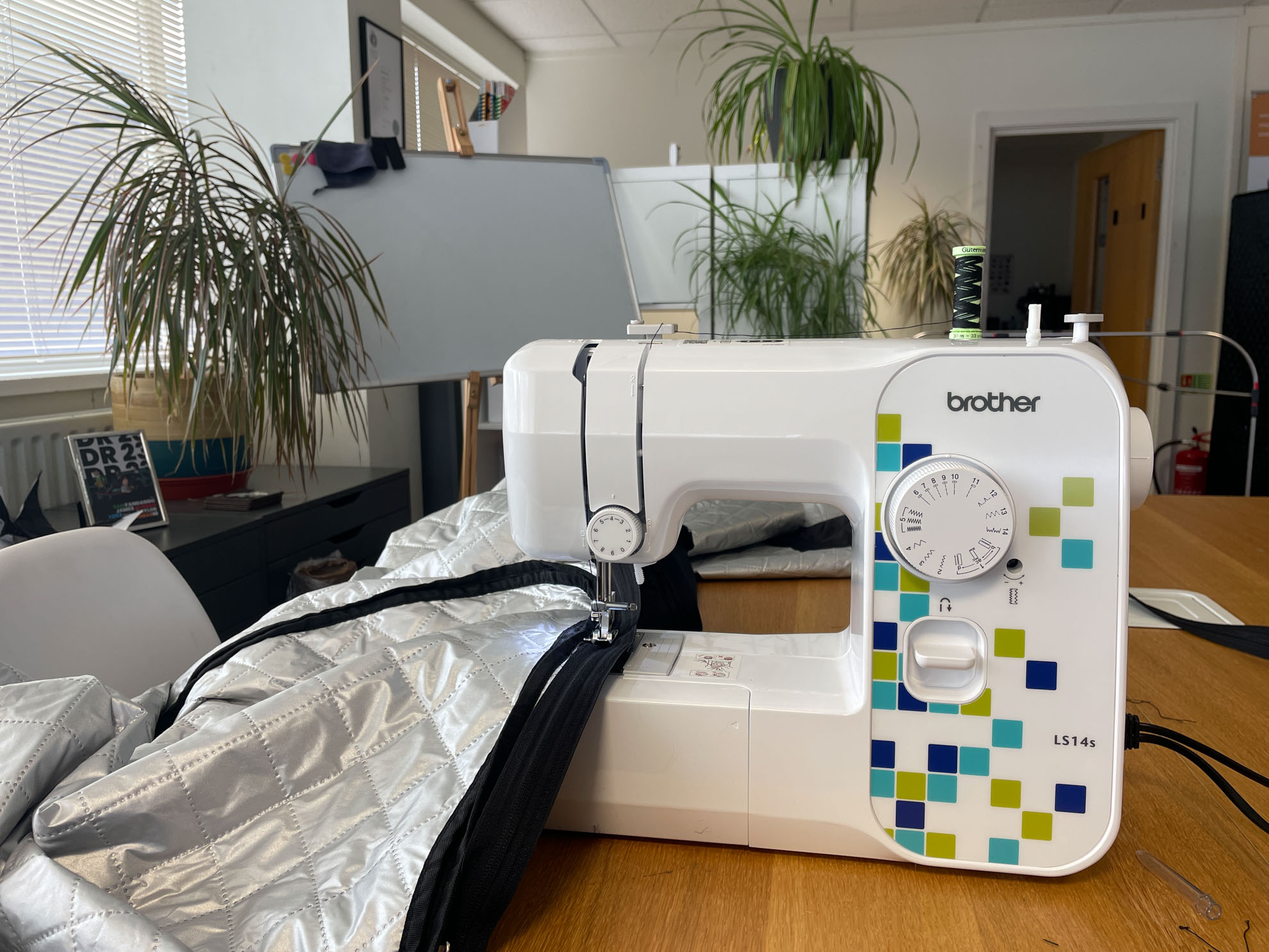 Sewing machine working on fabric prototype stitching